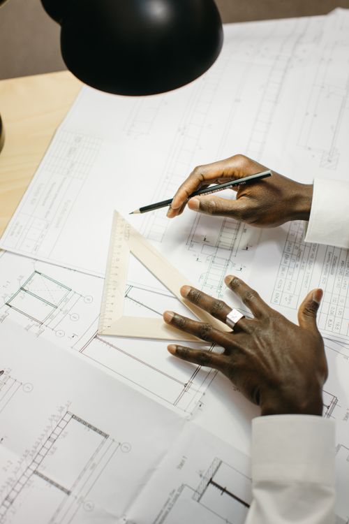 Technical drafting work with plans, pencil and drawing tools